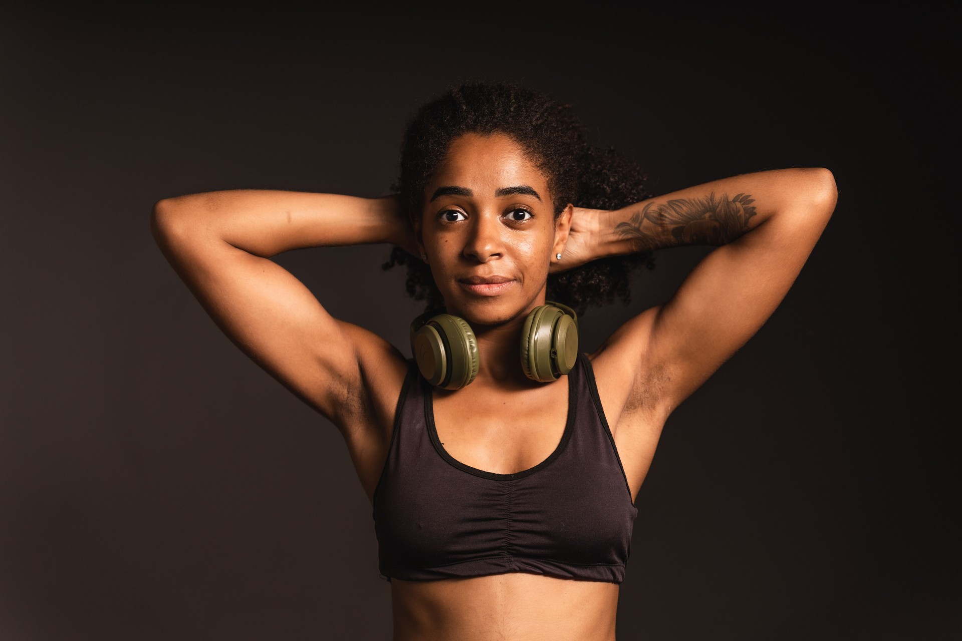 Portrait of a sportswoman with her hands on the back of her head